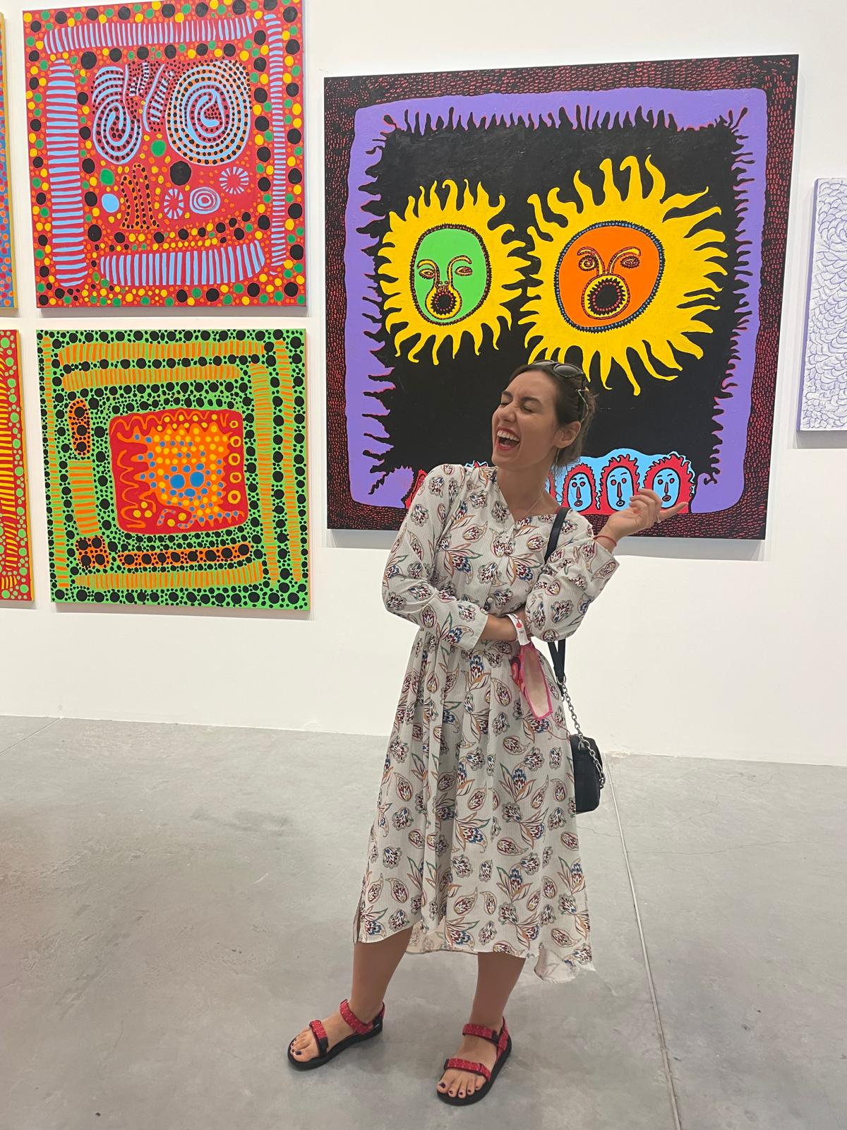 Ivaneta laughing in front of the same painting